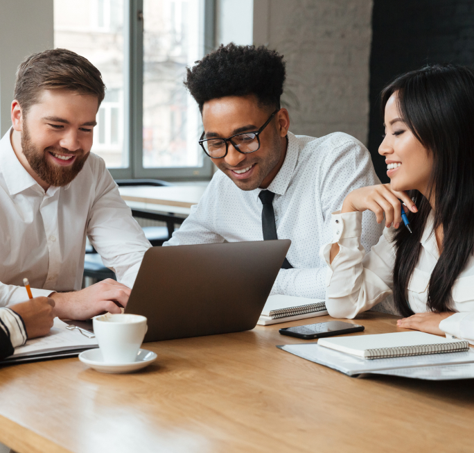 cheerful young colleagues indoors